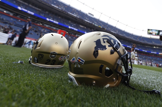 Colorado Buffaloes helmets sit in the end zone in the first half of an NCAA college football game Friday, Sept. 1, 2017, in Denver. (AP Photo/David Zalubowski)