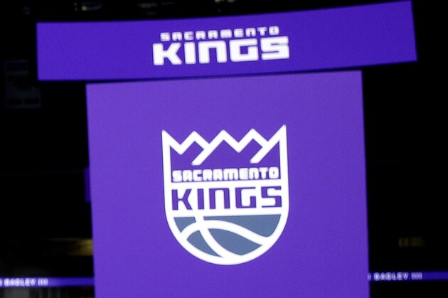 Marvin Begley III, whom the Sacramento Kings selected with the second pick in Thursday's NBA basketball draft, poses with a Kings jersey Saturday, June 23, 2018, in Sacramento, Calif. Bagley, a forward, played one season at Duke. (AP Photo/Rich Pedroncelli)