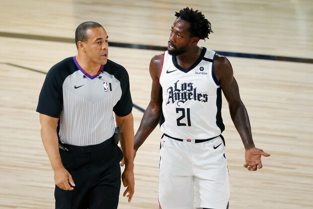 Los Angeles Clippers' Patrick Beverley (21) disputes a foul with referee Curtis Blair during the first half of an NBA basketball game Tuesday, Aug. 4, 2020, in Lake Buena Vista, Fla. (Kevin C. Cox/Pool Photo via AP)