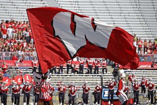 Wisconsin's Bucky Badger waves a flag before an NCAA college football game against Florida Atlantic Saturday, Sept. 9, 2017 in Madison, Wis. (AP Photo/Aaron Gash)