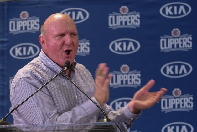 From left, Los Angeles Clippers team chairman Steve Ballmer introduces Paul George and Kawhi Leonard at a press conference at the Green Meadows Recreation Center in Los Angeles, Wednesday, July 23, 2019. (AP Photo/Ringo H.W. Chiu)