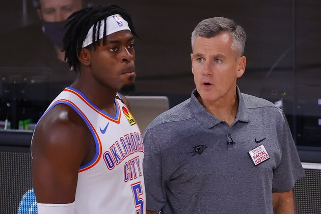 Oklahoma City Thunder head coach Billy Donovan, right, talks with Luguentz Dort (5) during the third quarter of Game 4 of an NBA basketball first-round playoff series against the Houston Rockets, Monday, Aug. 24, 2020, in Lake Buena Vista, Fla. (Kevin C. Cox/Pool Photo via AP)