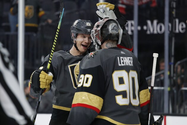 Vegas Golden Knights defenseman Nick Holden (22) celebrates with goaltender Robin Lehner after defeating the New Jersey Devils in an NHL hockey game Tuesday, March 3, 2020, in Las Vegas. (AP Photo/John Locher)