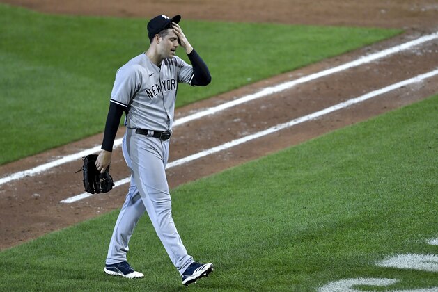 New York Yankees pitcher Adam Ottavino walks to the dugout after being pulled during the sixth inning of a baseball game against the Toronto Blue Jays in Buffalo, N.Y., Monday, Sept. 7, 2020. (AP Photo/Adrian Kraus)