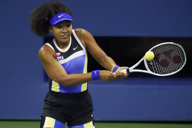 Naomi Osaka, of Japan, returns to Shelby Rogers, of the United States, during the quarterfinal round of the US Open tennis championships, Tuesday, Sept. 8, 2020, in New York. (AP Photo/Frank Franklin II)