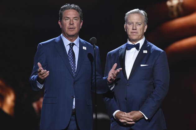 Dan Marino, left, and John Elway present the Jimmy V award for perseverance at the ESPY Awards at Microsoft Theater on Wednesday, July 18, 2018, in Los Angeles. (Photo by Phil McCarten/Invision/AP)