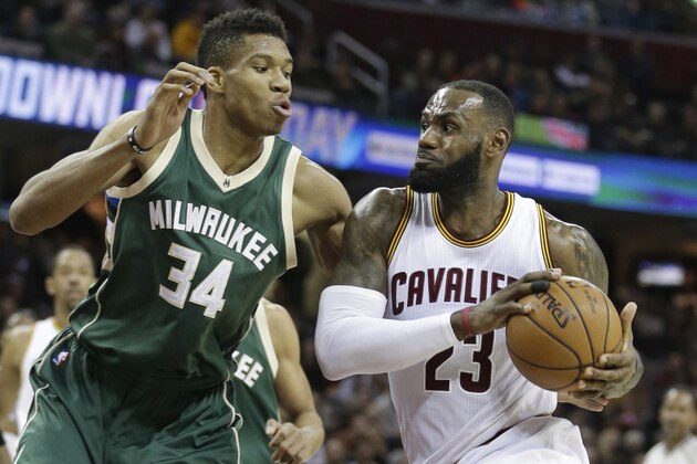 Cleveland Cavaliers' LeBron James (23) drives past Milwaukee Bucks' Giannis Antetokounmpo (34) during the first half of an NBA basketball game, Wednesday, Dec. 21, 2016, in Cleveland. (AP Photo/Tony Dejak)