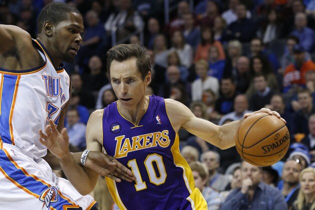 Los Angeles Lakers guard Steve Nash (10) drives around Oklahoma City Thunder forward Kevin Durant (35) in the first quarter of an NBA basketball game in Oklahoma City, Tuesday, March 5, 2013. (AP Photo/Sue Ogrocki)