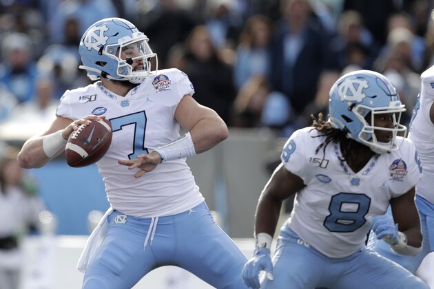 North Carolina quarterback Sam Howell throws a touchdown pass to wide receiver Dyami Brown during the first half of the Military Bowl NCAA college football game against Temple, Friday, Dec. 27, 2019, in Annapolis, Md. (AP Photo/Julio Cortez)