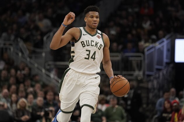Milwaukee Bucks' Giannis Antetokounmpo dribbles during the second half of an NBA basketball game against the Indiana Pacers Wednesday, March 4, 2020, in Milwaukee. The Bucks won 119-100. (AP Photo/Morry Gash)