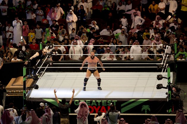 World Wrestling star Rusev is greeted by fans during his match of the