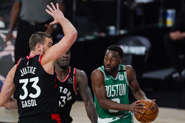 Boston Celtics guard Kemba Walker (8) looks to pass around Toronto Raptors center Marc Gasol (33) during the second half of an NBA conference semifinal playoff basketball game Wednesday, Sept. 9, 2020, in Lake Buena Vista, Fla. (AP Photo/Mark J. Terrill)
