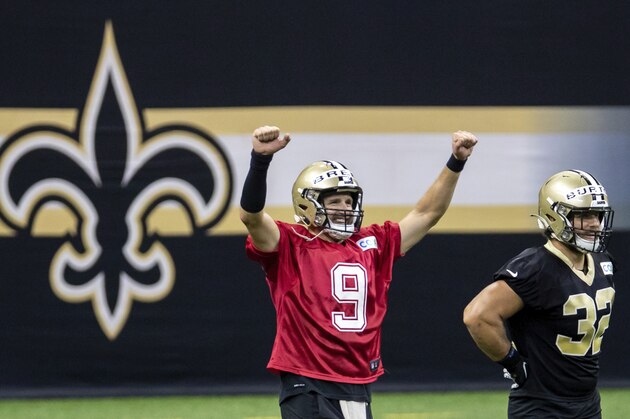 New Orleans Saints quarterback Drew Brees (9) reacts to beating the other quarterbacks to the tape during an NFL football training camp practice at the Superdome in New Orleans, Saturday, Aug. 29, 2020. (David Grunfeld/The Advocate via AP, Pool)