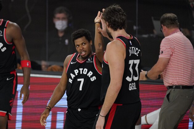 Toronto Raptors' Kyle Lowry (7) celebrates with teammate Marc Gasol (33) during the second half of an NBA conference semifinal playoff basketball game against the Boston Celtics Saturday, Sept. 5, 2020, in Lake Buena Vista, Fla. (AP Photo/Mark J. Terrill)