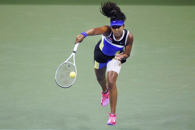 Naomi Osaka, of Japan, serves to Shelby Rogers, of the United States, during the quarterfinal round of the US Open tennis championships, Tuesday, Sept. 8, 2020, in New York. (AP Photo/Frank Franklin II)
