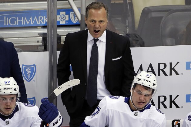 FILE - In this Feb. 11, 2020, file photo, Tampa Bay Lightning head coach Jon Cooper yells instructions during the third period of an NHL hockey game against the Pittsburgh Penguins in Pittsburgh. When Todd Reirden and Jon Cooper spent four months looking over video of the teams they coached this season, they saw almost polar opposites. Reirden's Washington Capitals started hot before their defensive game slipped. Cooper's Tampa Bay Lightning took a while to warm up, then won 14 of 21 games before the NHL season was halted in mid-March because of the COVID-19 pandemic. (AP Photo/Gene J. Puskar, File)