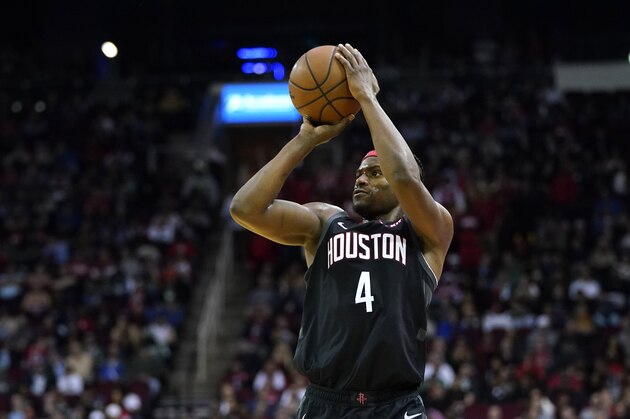 Houston Rockets' Danuel House Jr. (4) shoots against the Boston Celtics during the first half of an NBA basketball game Tuesday, Feb. 11, 2020, in Houston. (AP Photo/David J. Phillip)