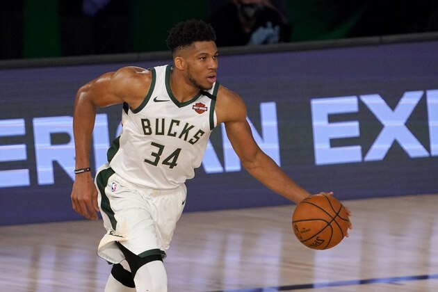 Milwaukee Bucks' Giannis Antetokounmpo (34) handles the ball during the second half of an NBA basketball conference semifinal playoff game, Monday, Aug. 31, 2020, in Lake Buena Vista, Fla. (AP Photo/Mark J. Terrill)