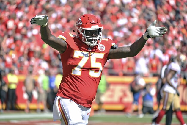 Kansas City Chiefs offensive lineman Cam Erving (75) gestures during the first half of an NFL football game against the San Francisco 49ers in Kansas City, Mo., Sunday, Sept. 23, 2018. (AP Photo/Ed Zurga)