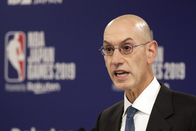 FILE - In this Oct. 8, 2019, file photo, NBA Commissioner Adam Silver speaks at a news conference before an NBA preseason basketball game between the Houston Rockets and the Toronto Raptors in Saitama, Japan. A person familiar with the negotiations says the NBA is working with the players’ union and its teams on a plan to shorten the regular season, possibly to 78 games.  (AP Photo/Jae C. Hong, File)