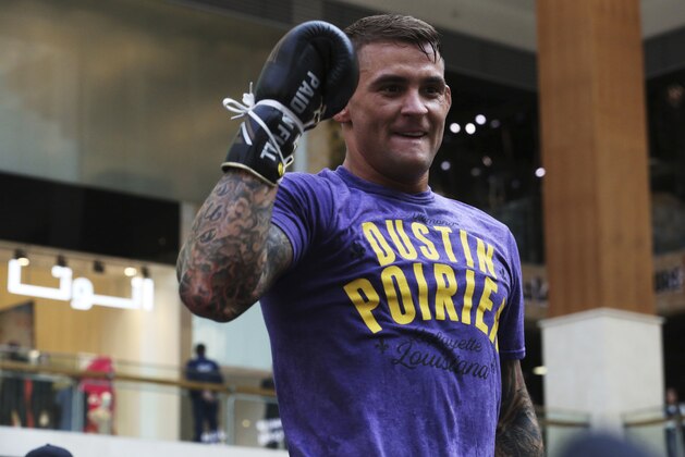 UFC fighter Dustin Poirier of Lafayette, Louisiana, gestures during an open training session at Yas Mall in Abu Dhabi, United Arab Emirates, Wednesday, Sept. 4, 2019. Fighters Dustin Poirier and Khabib Nurmagomedov will face each other in UFC 242, which will be held Saturday, Sept. 7, 2019, in Abu Dhabi. (AP Photo/Jon Gambrell)