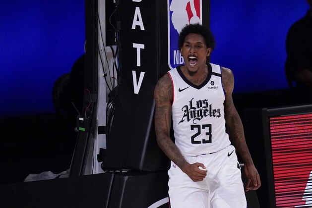 Los Angeles Clippers' Lou Williams (23) celebrates after scoring and drawing a foul during the second half of an NBA conference semifinal playoff basketball game against the Denver Nuggets, Wednesday, Sept. 9, 2020, in Lake Buena Vista, Fla. (AP Photo/Mark J. Terrill)