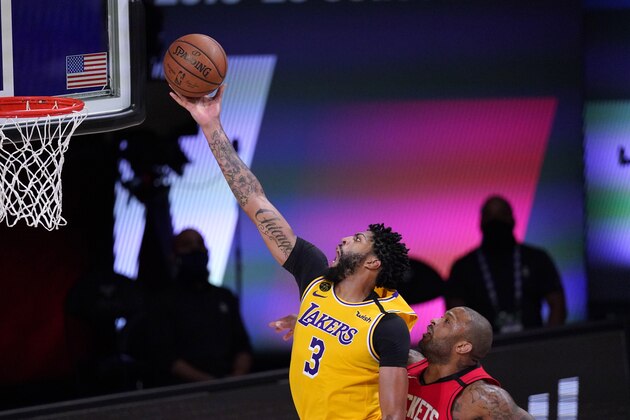 Los Angeles Lakers' Anthony Davis (3) goes up for a shot as Houston Rockets' P.J. Tucker defends during the second half of an NBA conference semifinal playoff basketball game Thursday, Sept. 10, 2020, in Lake Buena Vista, Fla. (AP Photo/Mark J. Terrill)