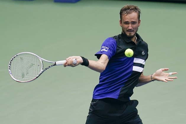 Daniil Medvedev, of Russia, returns a shot to Andrey Rublev, of Russia, during the quarterfinals of the US Open tennis championships, Wednesday, Sept. 9, 2020, in New York. (AP Photo/Seth Wenig)