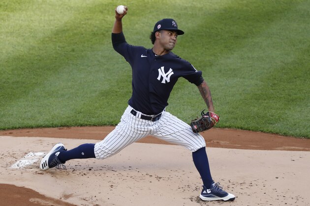 New York Yankees starting pitcher Deivi Garcia winds up during the first inning of an exhibition baseball game against the Philadelphia Phillies, Monday, July 20, 2020, at Yankee Stadium in New York. (AP Photo/Kathy Willens)