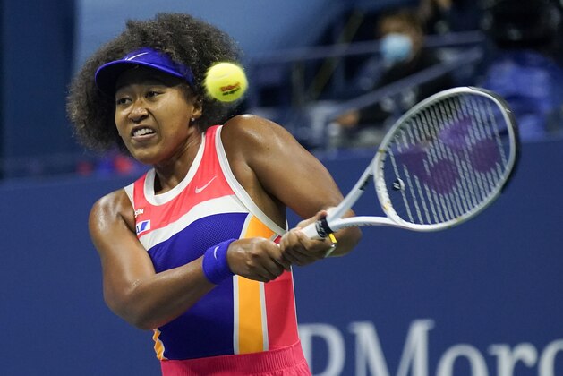 Naomi Osaka, of Japan, returns a shot to Jennifer Brady, of the United States, during a semifinal match of the US Open tennis championships, Thursday, Sept. 10, 2020, in New York. (AP Photo/Seth Wenig)