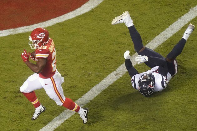 Kansas City Chiefs running back Clyde Edwards-Helaire (25) scores a touchdown on a 27-yard run ahead of Houston Texans linebacker Jacob Martin (54) in the second half of an NFL football game Thursday, Sept. 10, 2020, in Kansas City, Mo. (AP Photo/Charlie Riedel)