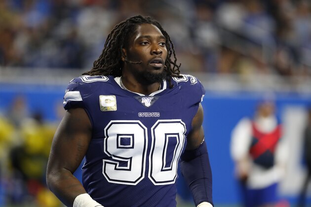 Dallas Cowboys defensive end Demarcus Lawrence runs onto the field before the second half of an NFL football game, Sunday, Nov. 17, 2019, in Detroit. (AP Photo/Paul Sancya)