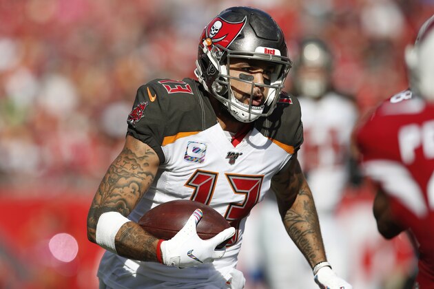 Tampa Bay Buccaneers wide receiver Mike Evans (13) runs with the ball after a catch against the Arizona Cardinals during an NFL football game Sunday, Nov. 10, 2019, in Tampa, Fla. The Buccaneers won the game 30-27. (Jeff Haynes/AP Images for Panini)