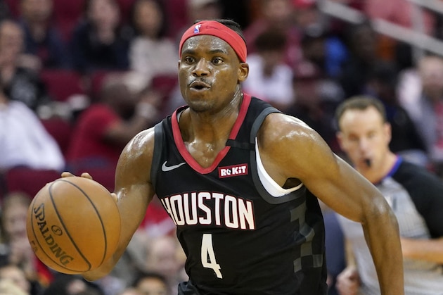 Houston Rockets' Danuel House Jr. (4) brings the ball up the court against the Boston Celtics during the first half of an NBA basketball game Tuesday, Feb. 11, 2020, in Houston. (AP Photo/David J. Phillip)
