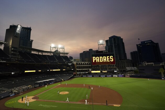 Smoke from California wildfires mixes with low clouds as the San Diego Padres play the Colorado Rockies in a baseball game at Petco Park Wednesday, Sept. 9, 2020, in San Diego. (AP Photo/Gregory Bull)