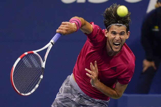 Dominic Thiem, of Austria, serves to Daniil Medvedev, of Russia, during a men's semifinal match of the US Open tennis championships, Friday, Sept. 11, 2020, in New York. (AP Photo/Seth Wenig)