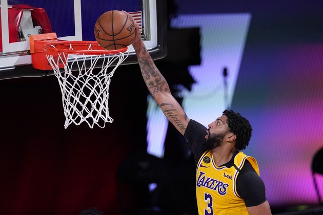 Los Angeles Lakers' Anthony Davis dunks the ball against the Houston Rockets during the second half of an NBA conference semifinal playoff basketball game Thursday, Sept. 10, 2020, in Lake Buena Vista, Fla. (AP Photo/Mark J. Terrill)