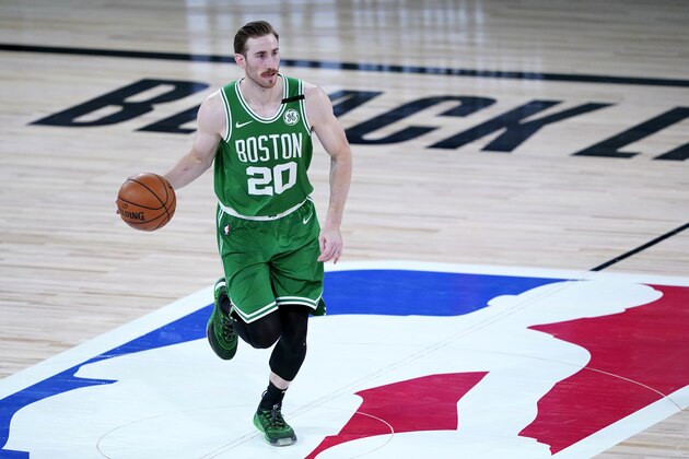 Boston Celtics' Gordon Hayward dribbles up court against the Toronto Raptors during the second half of an NBA basketball game Friday, Aug. 7, 2020 in Lake Buena Vista, Fla. (AP Photo/Ashley Landis, Pool)