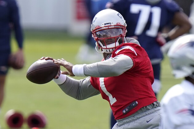 New England Patriots quarterback Cam Newton (1) winds up for a pass during an NFL football training camp practice, Wednesday, Aug. 26, 2020, in Foxborough, Mass. (AP Photo/Steven Senne, Pool)