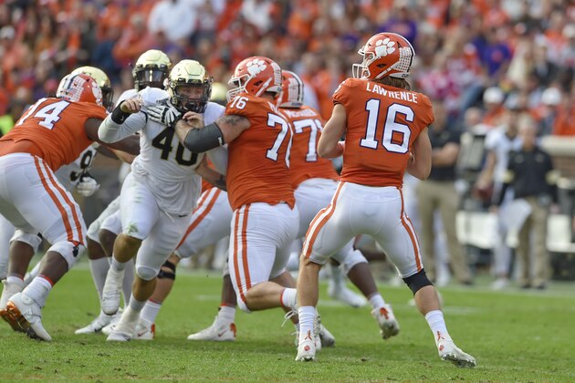 Clemson quarterback Trevor Lawrence (16) drops back to pass while looking for receivers during the first half of an NCAA college football game against Wake Forest Saturday, Nov. 16, 2019, in Clemson, S.C. (AP Photo/Richard Shiro)