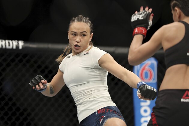Michelle Waterson, left, in action against Karolina Kowalkiewicz during their mixed martial arts bout at UFC Fight Night, Saturday, March 30, 2019, in Philadelphia. Waterson won via decision. (AP Photo/Gregory Payan)