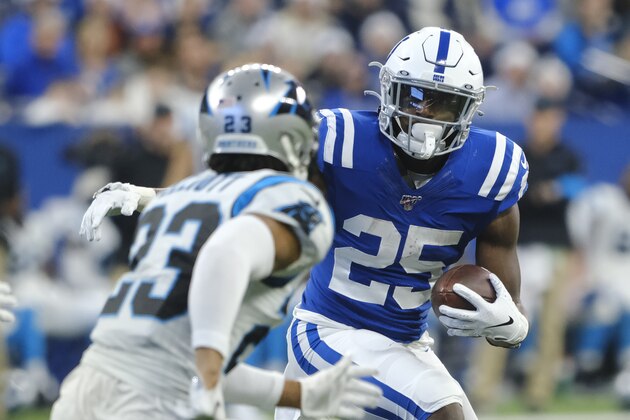 Indianapolis Colts' Marlon Mack (25) runs against Carolina Panthers' Javien Elliott (23) during the first half of an NFL football game, Sunday, Dec. 22, 2019, in Indianapolis. (AP Photo/AJ Mast)