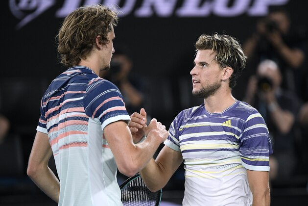 Austria's Dominic Thiem, right, is congratulated by Germany's Alexander Zverev after winning their semifinal match at the Australian Open tennis championship in Melbourne, Australia, Friday, Jan. 31, 2020. (AP Photo/Andy Brownbill)
