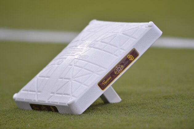 A detailed view of first the base bag with a commemorative logo celebrating 50 years of a San Diego Padres baseball before the game against the San Francisco Giants Friday, March 29, 2019, in San Diego. (AP Photo/Orlando Ramirez)