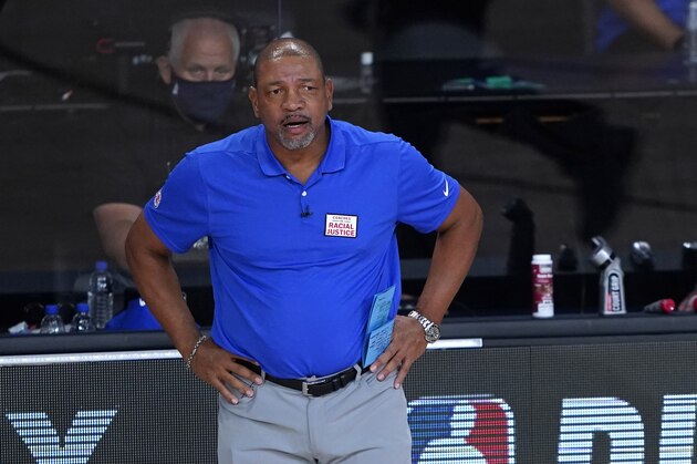 Los Angeles Clippers head coach Doc Rivers watches during the second half of an NBA basketball first round playoff game against the Dallas Mavericks Sunday, Aug. 23, 2020, in Lake Buena Vista, Fla. (AP Photo/Ashley Landis, Pool)