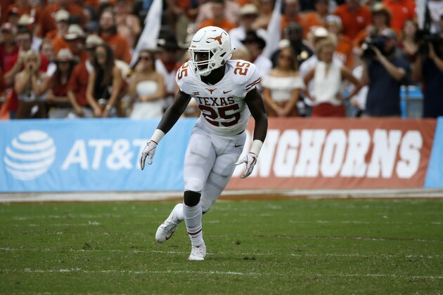 Texas Longhorns safety B.J. Foster defends during the first half of an NCAA college football game against the Oklahoma Sooners, Saturday, Oct. 6, 2018, in Dallas, Texas. (AP Photo/Roger Steinman)