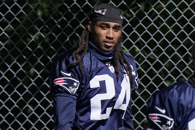 New England Patriots cornerback Stephon Gilmore steps on the field for an NFL football training camp practice, Sunday, Aug. 30, 2020, in Foxborough, Mass. (AP Photo/Steven Senne, Pool)