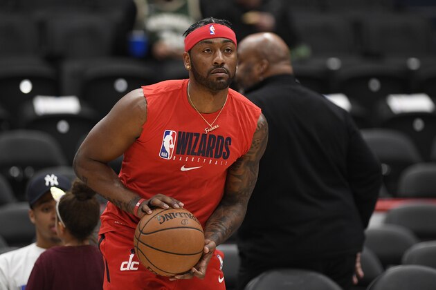 Washington Wizards guard John Wall works out prior to an NBA basketball game against the Milwaukee Bucks, Monday, Feb. 24, 2020, in Washington. (AP Photo/Nick Wass)