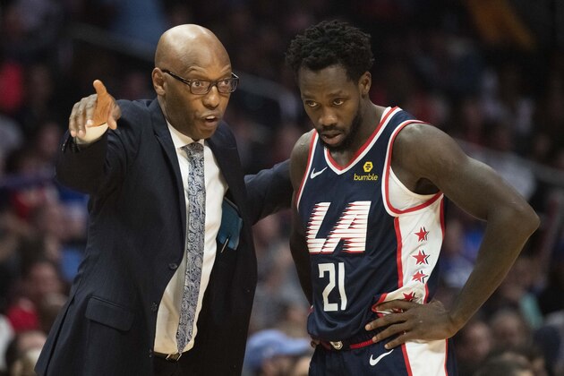Los Angeles Clippers assistant coach Sam Cassell gives an instruction to guard Patrick Beverley in an NBA basketball game against the Denver Nuggets in Los Angeles Saturday, Dec. 22, 2018. (AP Photo/Kyusung Gong)