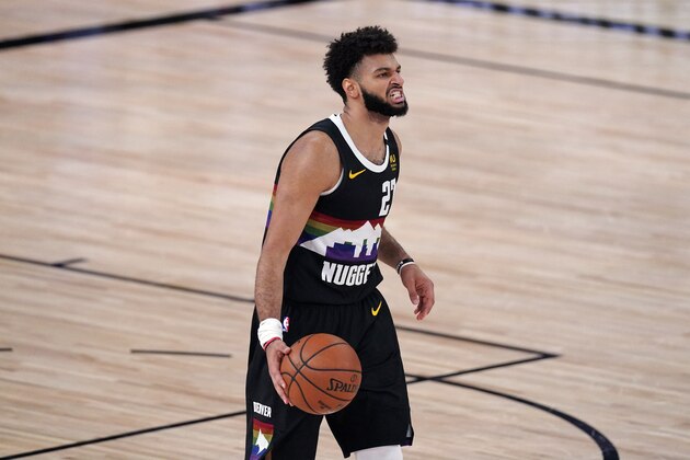 Denver Nuggets' Jamal Murray (27) brings the ball up the court against the Los Angeles Clippers during the second half of an NBA conference semifinal playoff basketball game Sunday, Sept. 13, 2020, in Lake Buena Vista, Fla. (AP Photo/Mark J. Terrill)